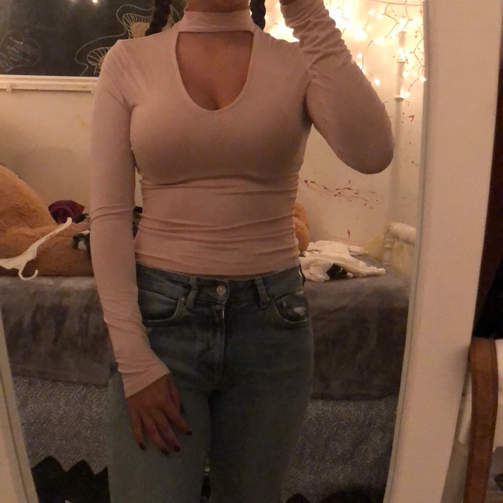 Long sleeve tee with cutout chest. Worn once.